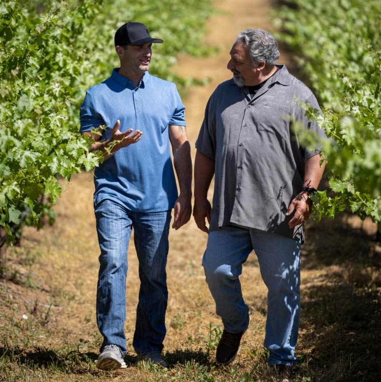 Todd Lands with Community Member or Orchard