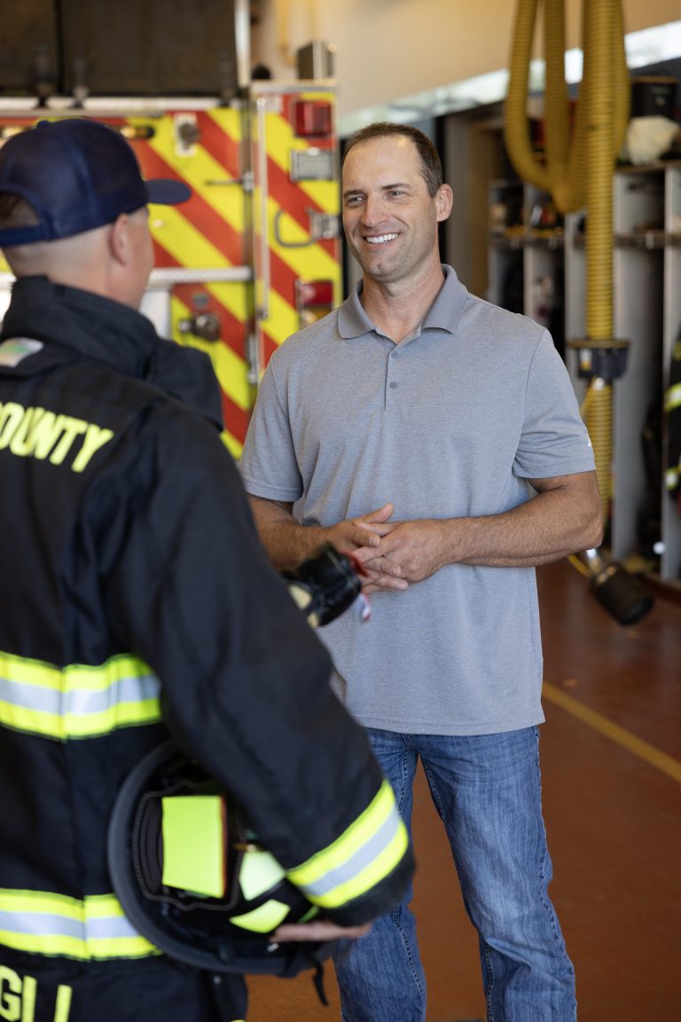 Todd Lands with Firefighters