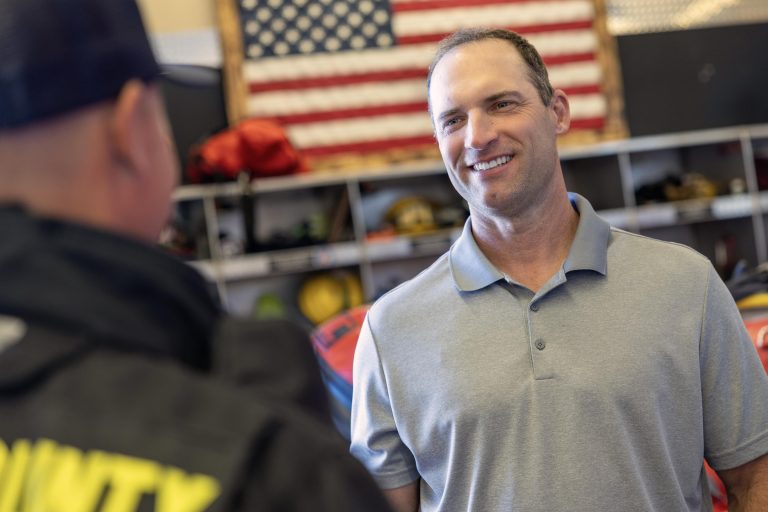 Todd Lands with Firefighters